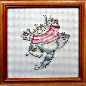 Framed Cross Stitch Embroidery picture of a cat in a red dress